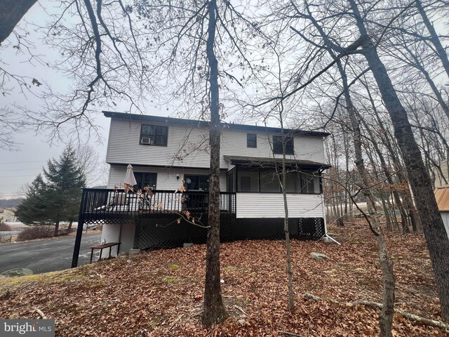 1076 Lancaster Dr, Bushkill, PA 18324 - back of house featuring aphalt driveway and a wooden deck
