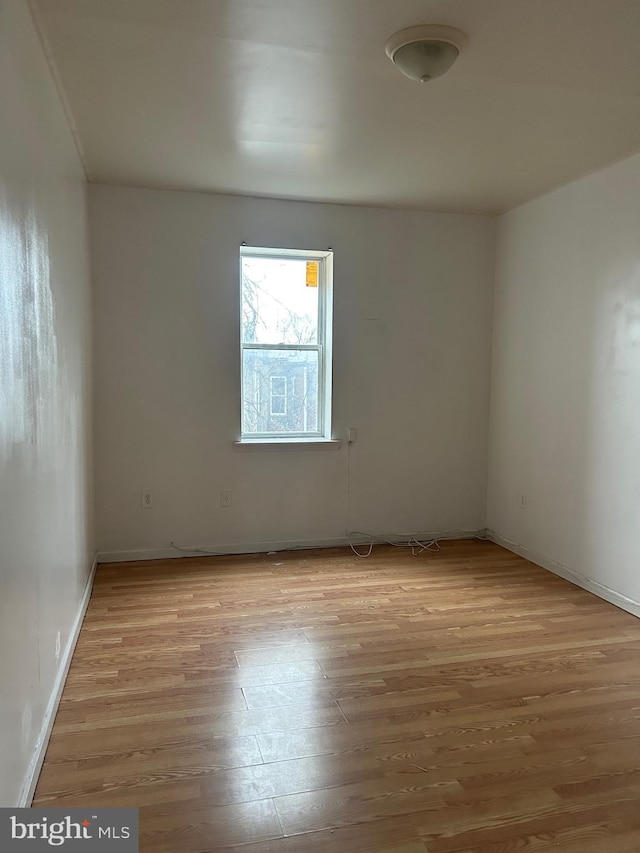 spare room with light wood finished floors