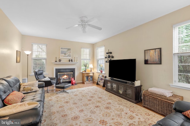 822 Rhinehart Ln, Phoenixville, PA 19460 - living room featuring plenty of natural light, ceiling fan, wood finished floors, and a fireplace with flush hearth