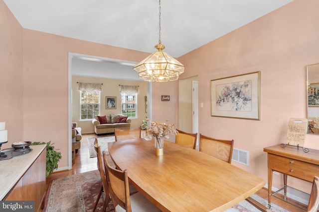822 Rhinehart Ln, Phoenixville, PA 19460 - dining space with a chandelier, wood finished floors, and baseboards