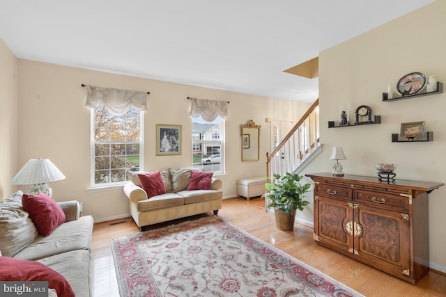 822 Rhinehart Ln, Phoenixville, PA 19460 - living area with light wood-style flooring, stairs, and baseboards