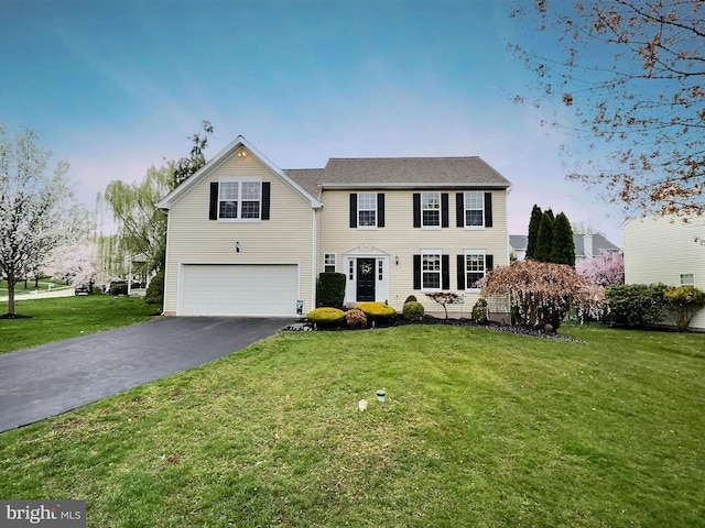 822 Rhinehart Ln, Phoenixville, PA 19460 - view of front of home featuring an attached garage, asphalt driveway, and a front yard