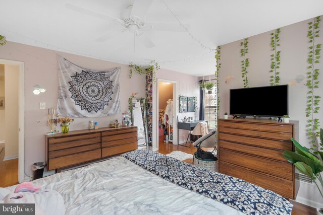 822 Rhinehart Ln, Phoenixville, PA 19460 - bedroom with a walk in closet, wood finished floors, and ceiling fan