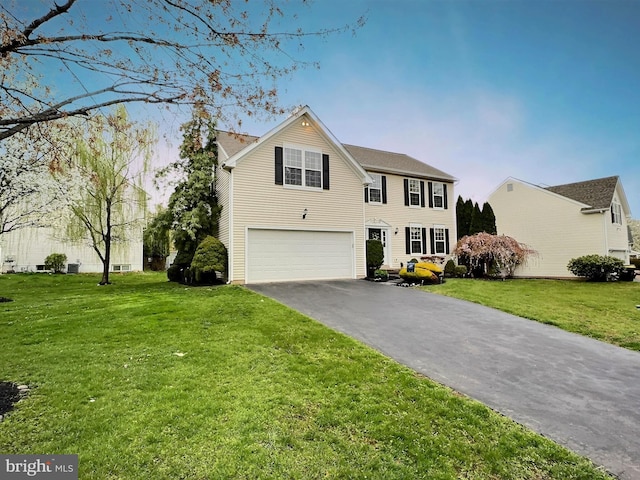 822 Rhinehart Ln, Phoenixville, PA 19460 - view of front of house featuring a garage, asphalt driveway, and a front lawn