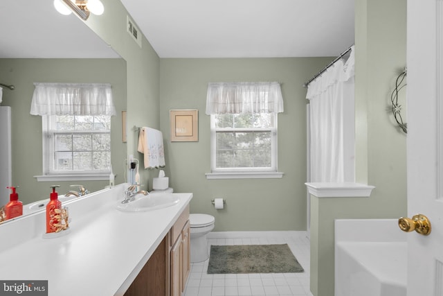 822 Rhinehart Ln, Phoenixville, PA 19460 - bathroom with tile patterned floors, vanity, toilet, a bath, and baseboards
