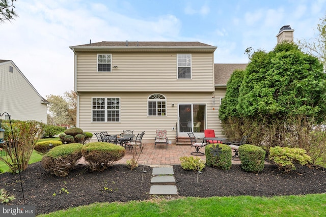822 Rhinehart Ln, Phoenixville, PA 19460 - rear view of house with a patio and a chimney
