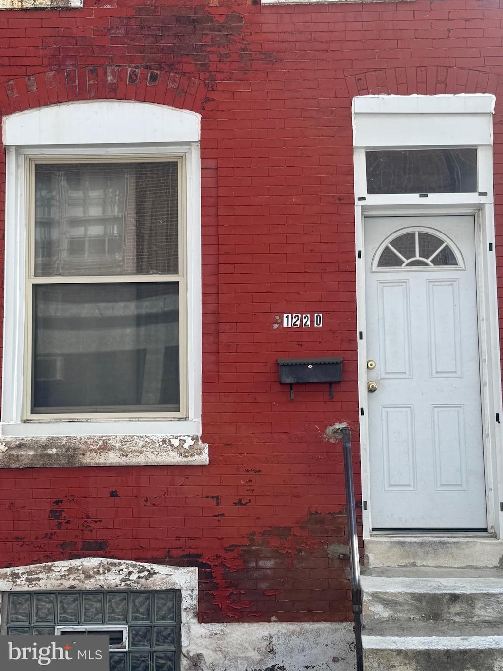 entrance to property with brick siding