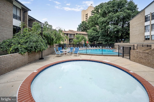 104 Monroe St Unit 201, Rockville, MD 20850 - community pool featuring a patio area