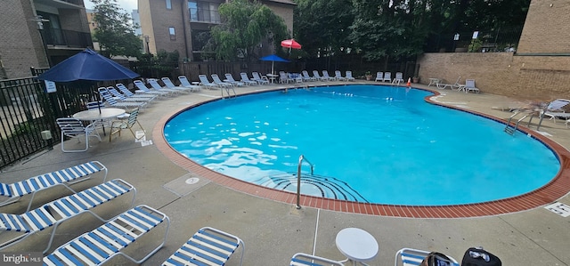104 Monroe St Unit 201, Rockville, MD 20850 - community pool featuring a patio area