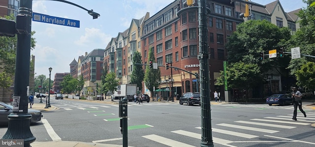 104 Monroe St Unit 201, Rockville, MD 20850 - view of asphalt street with street lights, sidewalks, curbs, and traffic lights