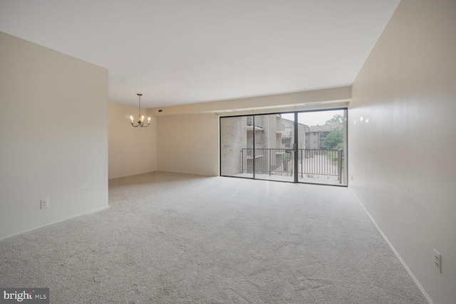 104 Monroe St Unit 201, Rockville, MD 20850 - carpeted spare room with a chandelier and baseboards