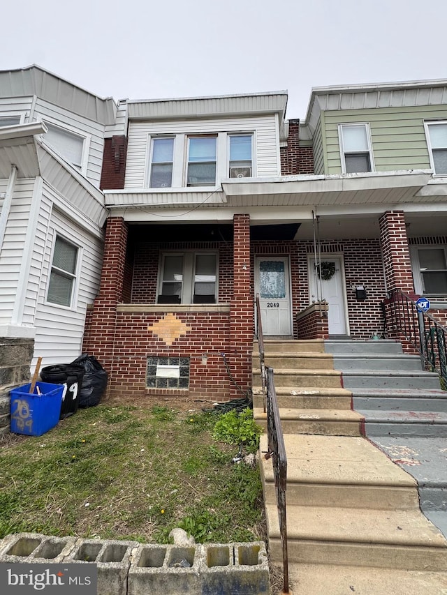 view of front of property featuring brick siding