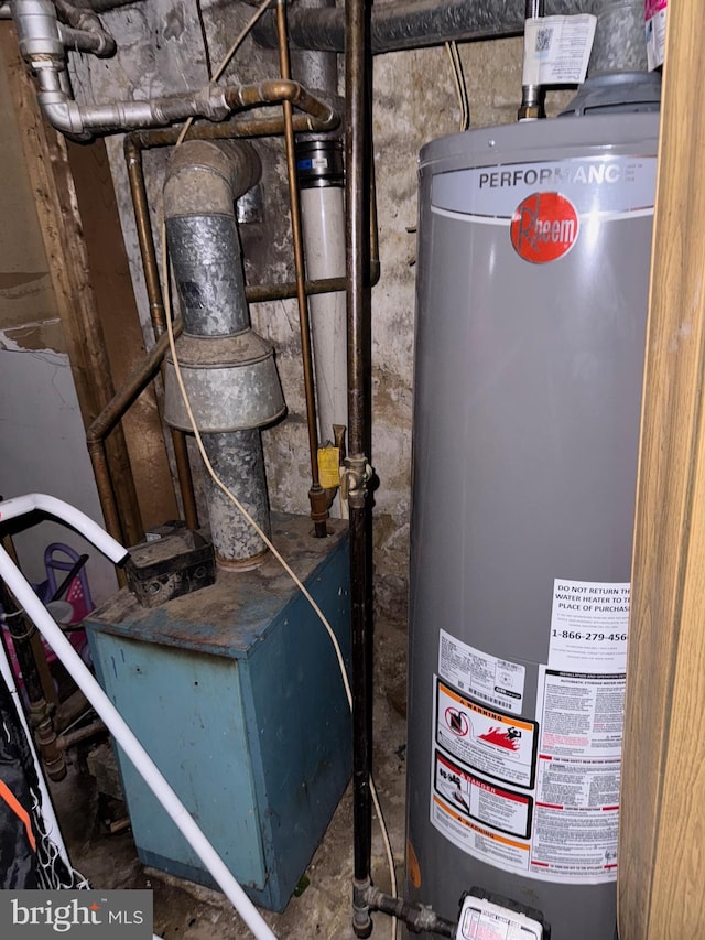 utility room featuring gas water heater