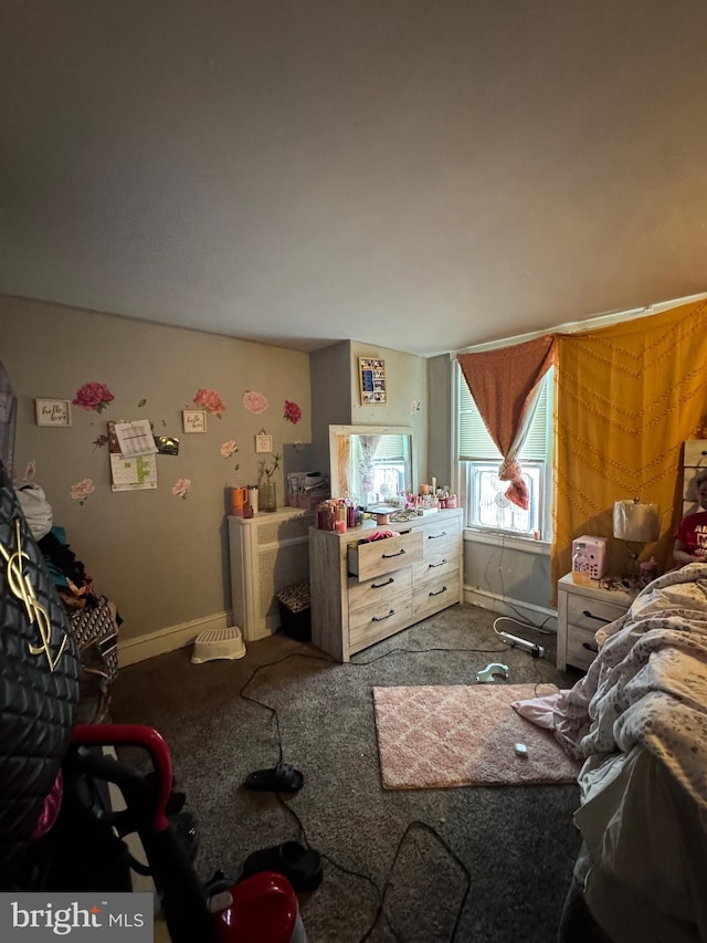 bedroom with carpet floors and baseboards