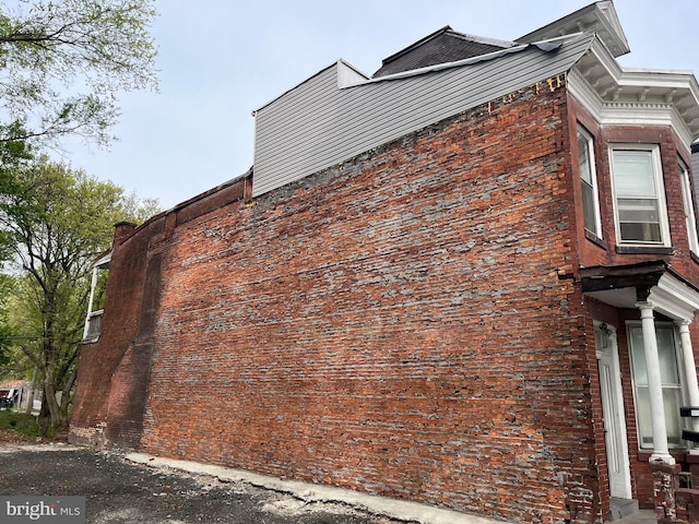 2628 N 6th St, Harrisburg, PA 17110 - view of home's exterior featuring a chimney and brick siding