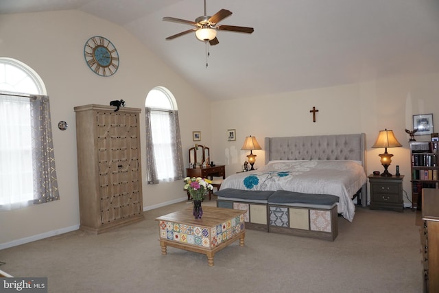 carpeted bedroom featuring high vaulted ceiling and baseboards