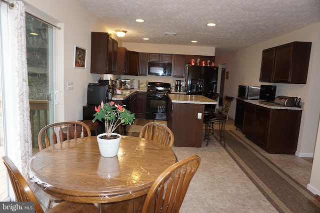 dining area featuring recessed lighting and a textured ceiling