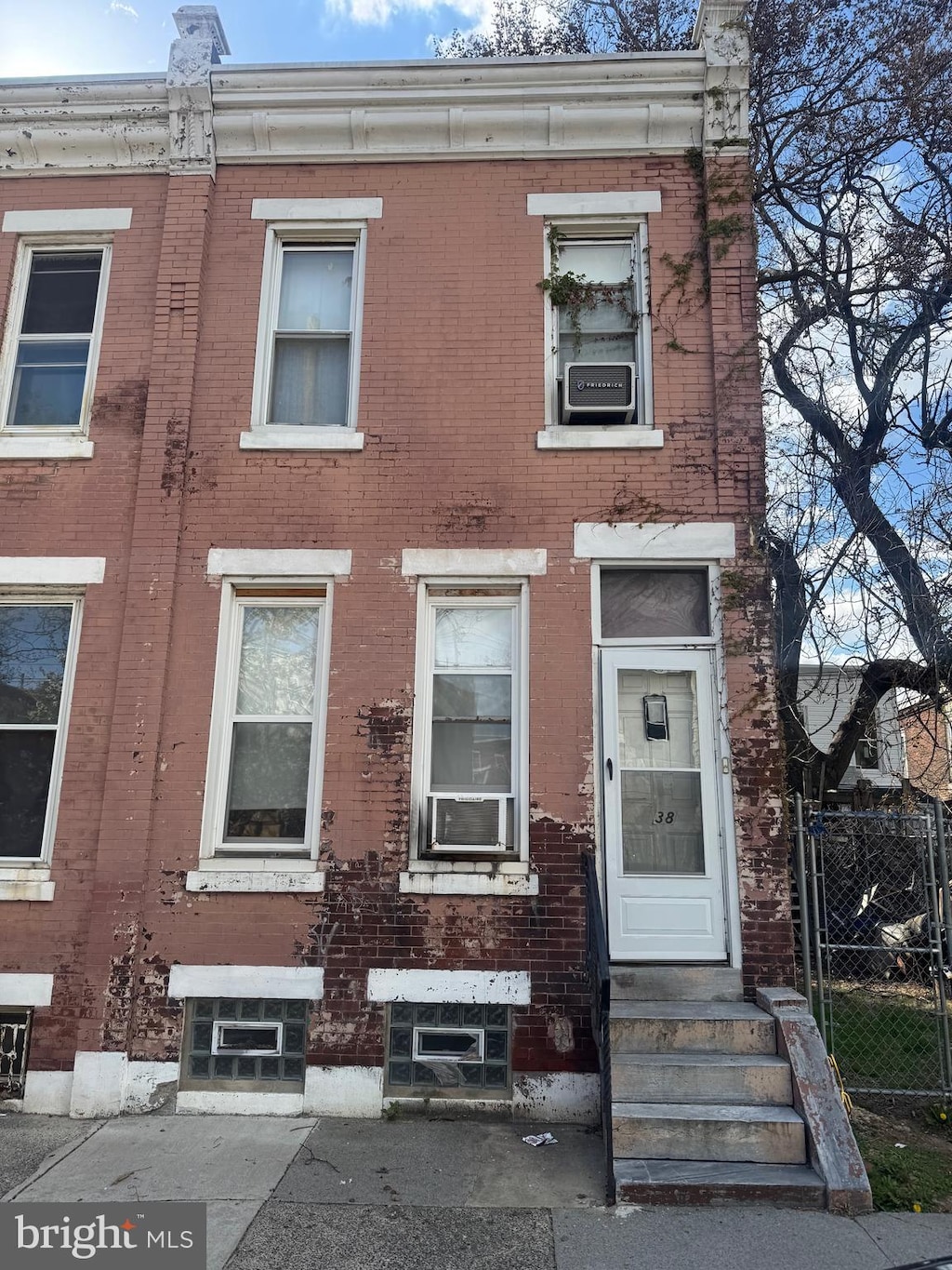 2838 N Darien St, Philadelphia, PA 19133 - townhome / multi-family property with brick siding, entry steps, fence, and cooling unit