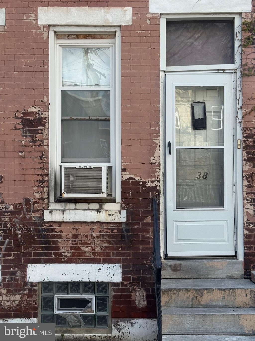 2838 N Darien St, Philadelphia, PA 19133 - property entrance with brick siding and cooling unit
