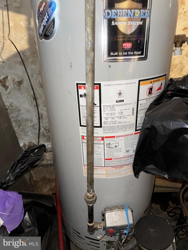 utility room featuring water heater