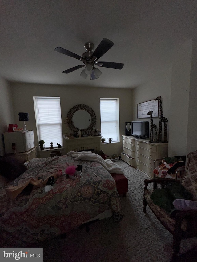 carpeted bedroom with a ceiling fan