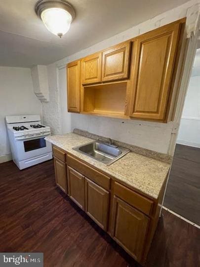 3128 N Darien St, Philadelphia, PA 19133 - kitchen featuring a sink, light countertops, white range with gas stovetop, and dark wood finished floors