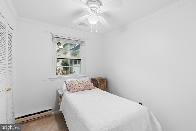 bedroom with baseboard heating, crown molding, visible vents, ceiling fan, and carpet