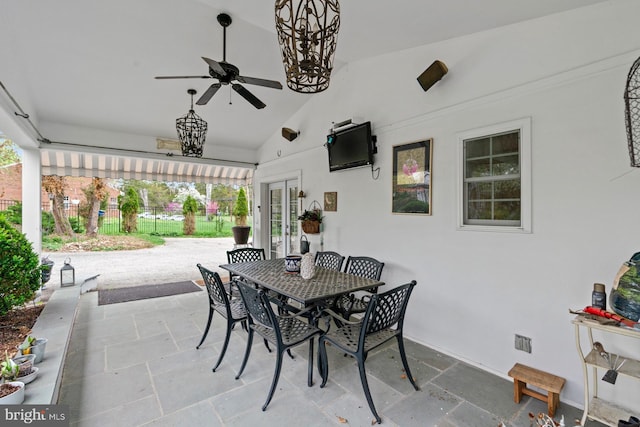 view of patio with outdoor dining area, french doors, fence, and ceiling fan