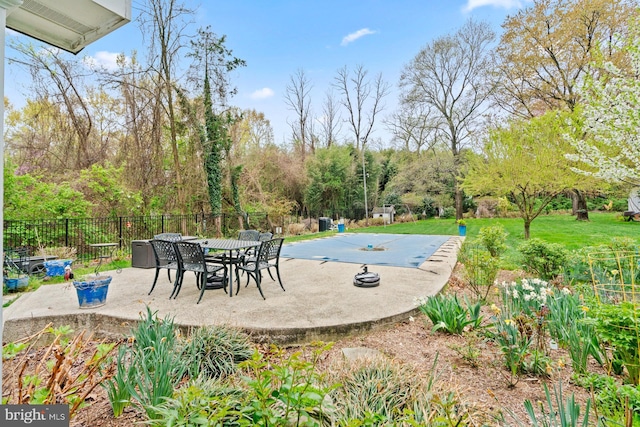view of pool featuring a patio, a yard, and fence