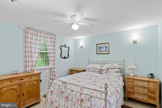 bedroom with light tile patterned floors and a ceiling fan