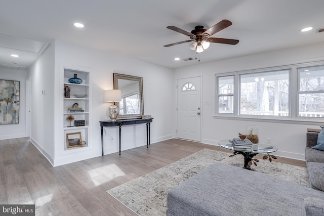entrance foyer featuring wood finished floors, baseboards, a ceiling fan, and recessed lighting