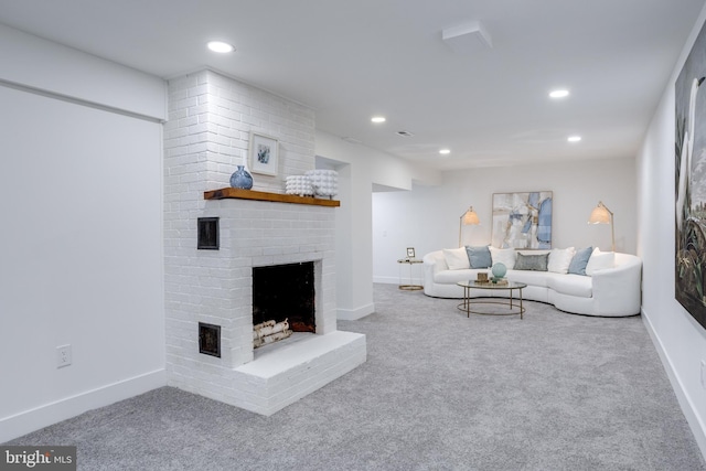 carpeted living area with baseboards, recessed lighting, and a fireplace