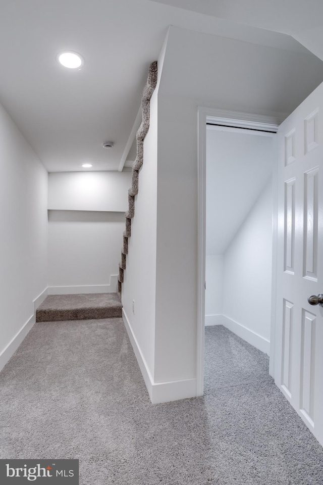 below grade area with baseboards, recessed lighting, and carpet