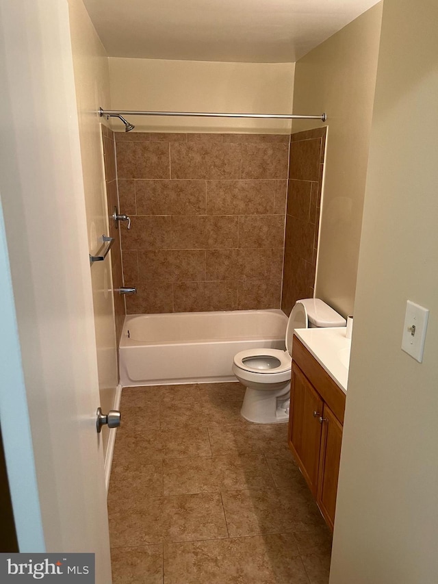 bathroom with shower / bath combination, vanity, and toilet