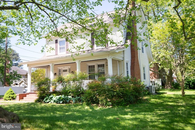 111 Somerset Ave, Cambridge, MD 21613 - view of front of house featuring a porch and a front yard