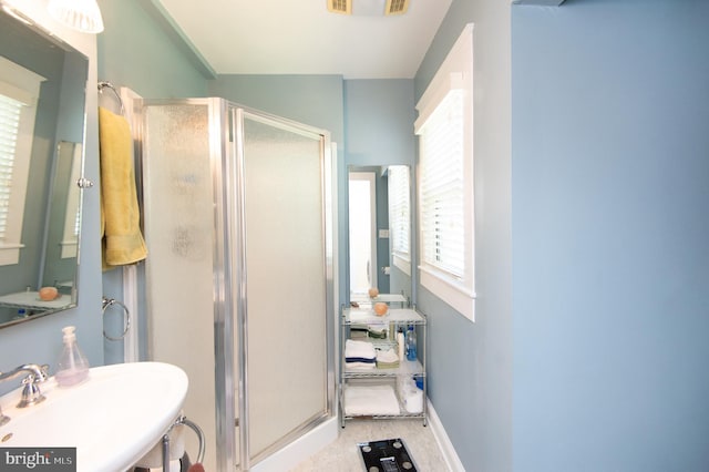 111 Somerset Ave, Cambridge, MD 21613 - bathroom featuring a sink, baseboards, and a shower stall