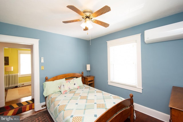 111 Somerset Ave, Cambridge, MD 21613 - bedroom with radiator heating unit, a ceiling fan, baseboards, a wall unit AC, and wood finished floors