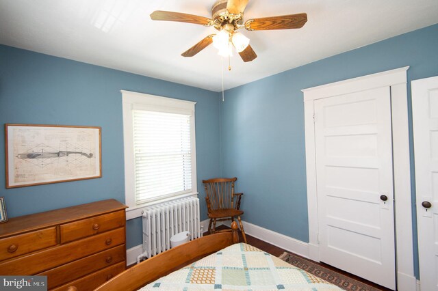 111 Somerset Ave, Cambridge, MD 21613 - bedroom featuring radiator, baseboards, a ceiling fan, and wood finished floors