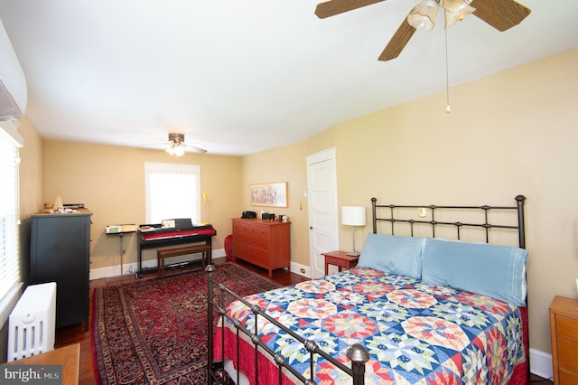 111 Somerset Ave, Cambridge, MD 21613 - bedroom featuring wood finished floors, baseboards, ceiling fan, and radiator heating unit