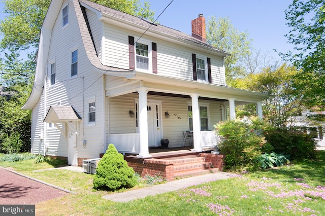 111 Somerset Ave, Cambridge, MD 21613 - view of front of property with roof with shingles, a chimney, and a porch