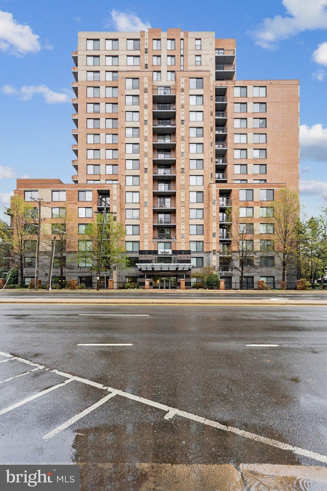 view of property featuring uncovered parking