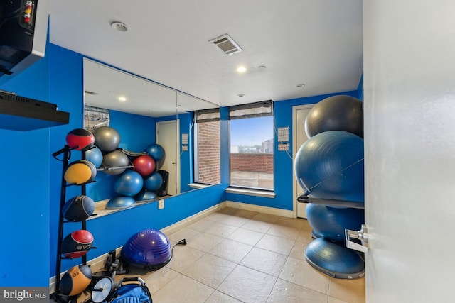 exercise room with tile patterned floors, baseboards, visible vents, and recessed lighting