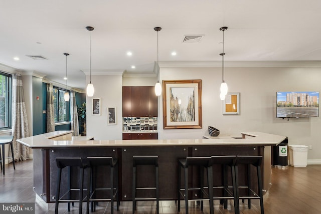 kitchen with dark wood-style flooring, visible vents, and backsplash
