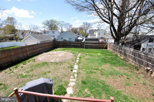 view of yard with a residential view and a fenced backyard