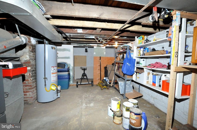 unfinished basement featuring gas water heater