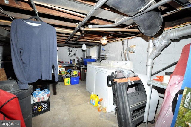 unfinished basement featuring washing machine and dryer