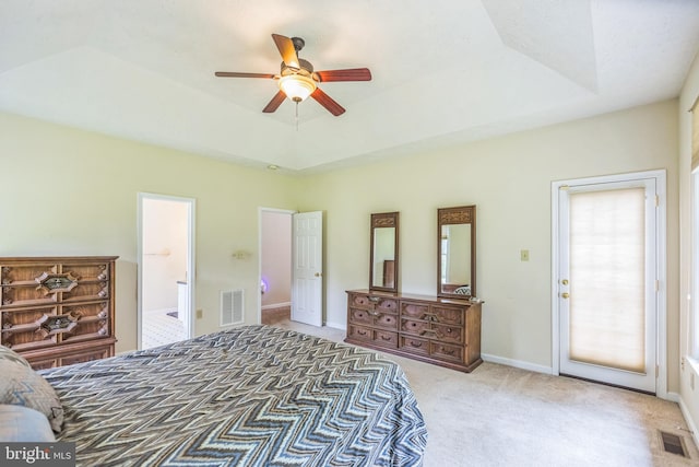 8900 Leonardo St, Pomfret, MD 20675 - carpeted bedroom featuring a raised ceiling, connected bathroom, ceiling fan, and baseboards
