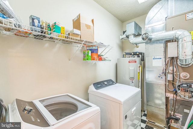 8900 Leonardo St, Pomfret, MD 20675 - laundry room with separate washer and dryer, electric water heater, and heating unit