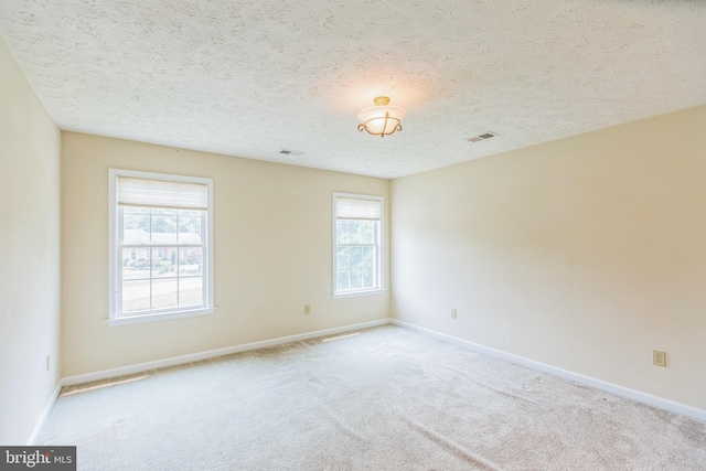 8900 Leonardo St, Pomfret, MD 20675 - carpeted spare room featuring plenty of natural light, baseboards, and a textured ceiling