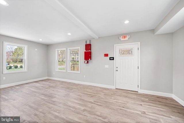 foyer with recessed lighting, light wood finished floors, baseboards, and beam ceiling